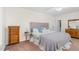 Comfortable bedroom featuring a plush bed, soft textures, and neutral tones at 2108 Canterbury Rd, Clayton, NC 27520