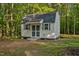 Outbuilding features a neutral exterior and ramp for easy access at 2108 Canterbury Rd, Clayton, NC 27520
