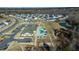 Community aerial view showcasing a pool, playground, sports field, and neighborhood homes at 2137 Caen St, Raleigh, NC 27610