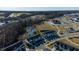 Beautiful aerial view of the neighborhood with a pond, soccer field, pool, and clubhouse at 2137 Caen St, Raleigh, NC 27610