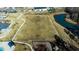 Overhead view of a community with a play park, pond, clubhouse and pool at 2137 Caen St, Raleigh, NC 27610