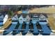 Overhead view of townhomes by a serene pond and athletic field, showcasing the community's layout at 2137 Caen St, Raleigh, NC 27610