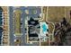 Overhead view of community amenities with a pool, clubhouse, and parking area, highlighting recreational features at 2137 Caen St, Raleigh, NC 27610