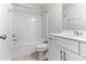 Bright, modern bathroom with a shower-tub combo and neutral color palette with a single sink vanity at 2137 Caen St, Raleigh, NC 27610