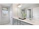 Modern bathroom with double vanity, gray cabinetry, and a large mirror at 2137 Caen St, Raleigh, NC 27610