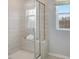 Modern bathroom featuring a glass-enclosed shower with a built-in bench and tile surround at 2137 Caen St, Raleigh, NC 27610