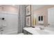 Well-lit bathroom with a tub-shower combination, a vanity, and decorative accents at 2137 Caen St, Raleigh, NC 27610