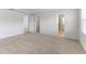Spacious bedroom offers ample natural light, neutral carpeting, and convenient access to the bathroom and closet at 2137 Caen St, Raleigh, NC 27610