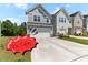 Charming two-story home with a two-car garage and a well-maintained lawn on a bright, sunny day at 2137 Caen St, Raleigh, NC 27610