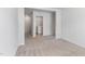 A laundry room with carpet flooring and entry to the laundry area at 2137 Caen St, Raleigh, NC 27610