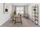 A staged office with a desk, chairs, and shelves at 2137 Caen St, Raleigh, NC 27610