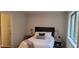 This bedroom features a bed, nightstands, lamps, and a window, creating a cozy and inviting space at 220 Elizabeth St # A-17, Chapel Hill, NC 27514