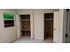 Bedroom features exposed brick in open closets, and a modern color block painting at 220 Elizabeth St # A-17, Chapel Hill, NC 27514