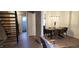 A dining table and chairs are showcased, complemented by wood flooring and natural light, creating a warm dining area at 220 Elizabeth St # A-17, Chapel Hill, NC 27514