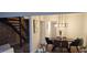 Beautiful dining room features modern light fixture and staircase at 220 Elizabeth St # A-17, Chapel Hill, NC 27514