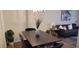 Dining room features a modern light fixture, seating for six, and views into the living room at 220 Elizabeth St # A-17, Chapel Hill, NC 27514