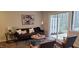 Cozy living room with stylish decor, comfortable seating, and sliding glass doors to the outside at 220 Elizabeth St # A-17, Chapel Hill, NC 27514