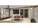 Outdoor patio with seating area and sliding glass door to the living area at 220 Elizabeth St # A-17, Chapel Hill, NC 27514