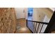 The staircase combines wood treads and brick walls, while providing access to an upstairs bathroom and bedroom at 220 Elizabeth St # A-17, Chapel Hill, NC 27514