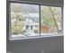 A view from the bedroom window showcases the property's proximity to a residential neighborhood with trees at 220 Elizabeth St # A-17, Chapel Hill, NC 27514