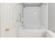 Bathroom features white subway tile, modern shower fixtures and white fixtures at 228 Adefield Ln, Holly Springs, NC 27540