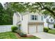Charming two-story home with a two-car garage and manicured front lawn and tasteful stone accents at 228 Adefield Ln, Holly Springs, NC 27540