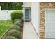 Inviting front entrance with well-maintained landscaping and a clean, modern walkway to the front door at 228 Adefield Ln, Holly Springs, NC 27540