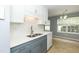 Kitchen view with breakfast nook, stainless sink, and lots of natural light at 228 Adefield Ln, Holly Springs, NC 27540