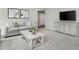 Cozy living room featuring plush seating, a modern entertainment center, and a neutral color scheme at 229 South Breeze Way, Fuquay Varina, NC 27526