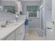 Charming bathroom featuring a large vanity, neutral colors, and a glass door shower at 2456 Nealwood Ave, Graham, NC 27253