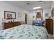 Bedroom view with comfortable seating area, dresser, mirror, and cozy quilt on a queen size bed at 2456 Nealwood Ave, Graham, NC 27253