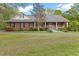 Charming brick home with a welcoming front porch and well-maintained landscaping at 2456 Nealwood Ave, Graham, NC 27253
