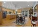 Open kitchen and dining area featuring stainless steel appliances and ample cabinet space at 2456 Nealwood Ave, Graham, NC 27253