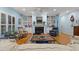 Bright living room with built-in bookshelves, fireplace, and a comfortable seating area at 2456 Nealwood Ave, Graham, NC 27253