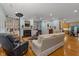 Spacious living room with hardwood floors, built-in shelves, and a cozy fireplace at 2456 Nealwood Ave, Graham, NC 27253