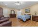 This primary suite features beautiful hardwood floors and classic furnishings at 2456 Nealwood Ave, Graham, NC 27253