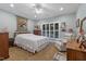 Bright bedroom showcasing a charming design and a comfortable sitting area at 2456 Nealwood Ave, Graham, NC 27253