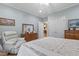 Bright bedroom featuring a neutral color palette, plenty of storage, and comfortable seating at 2456 Nealwood Ave, Graham, NC 27253