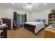 Cozy carpeted bedroom with a comfortable bed and view of the backyard at 2456 Nealwood Ave, Graham, NC 27253