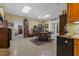 Recreation room with kitchenette, dining area, tile floor, and access to multiple rooms at 2456 Nealwood Ave, Graham, NC 27253