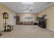 Carpeted recreation room with a sofa and tv area as well as seating and book cases at 2456 Nealwood Ave, Graham, NC 27253