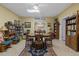 Large recreation room featuring a dining table, chairs, tile floors, and a ceiling fan at 2456 Nealwood Ave, Graham, NC 27253