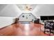 Bright bonus room features wood floors, natural light, ceiling fan, and is ready for entertainment or home office at 249 Mill Creek Dr, Clayton, NC 27527