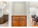 Cherry cabinet with drawers and doors in hallway between living room and dining room at 249 Mill Creek Dr, Clayton, NC 27527