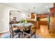 Charming dining area with hardwood floors, wood cabinets, and open access to the living room at 249 Mill Creek Dr, Clayton, NC 27527
