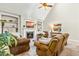Comfortable living room featuring a fireplace, built-in shelving, and cozy brown seating at 249 Mill Creek Dr, Clayton, NC 27527