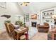 Cozy living room features a fireplace, built-in shelving, and comfortable brown seating arrangements at 249 Mill Creek Dr, Clayton, NC 27527