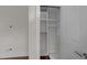 Walk-in closet with white shelving and ample storage space at 256 William Drummond Way, Raleigh, NC 27604