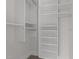 Walk-in closet with white shelving and ample storage space at 256 William Drummond Way, Raleigh, NC 27604