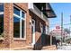 Charming brick building with a modern awning and close proximity to local shops at 256 William Drummond Way, Raleigh, NC 27604